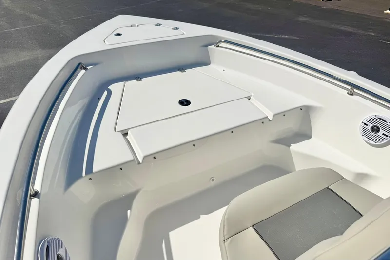 Slide: The Image of 2026 Key West 189 FS boat interior, featuring sleek seating and storage compartments. - 11
