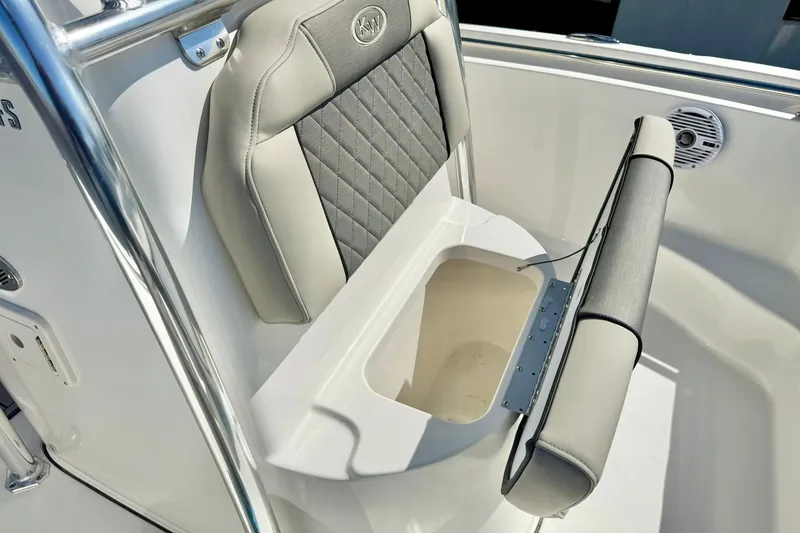 Slide: The Image of 2026 Key West 189 FS boat seat with storage compartment open. - 15