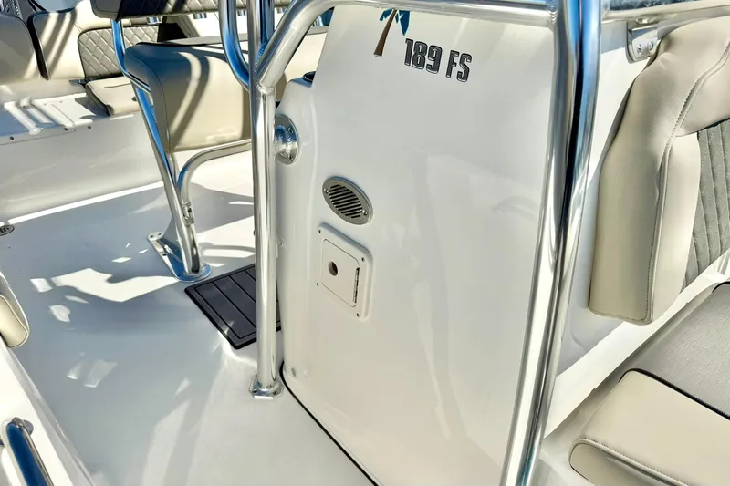 Slide: The Image of 2026 Key West 189 FS boat interior with seating and stainless steel details. - 16