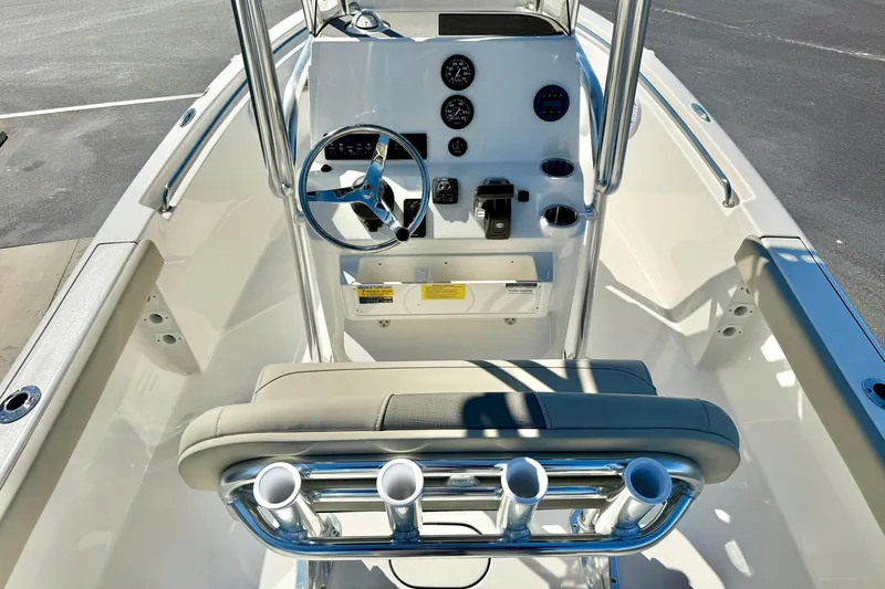 Slide: The Image of 2026 Key West 189 FS boat interior with steering wheel and control panel. - 17