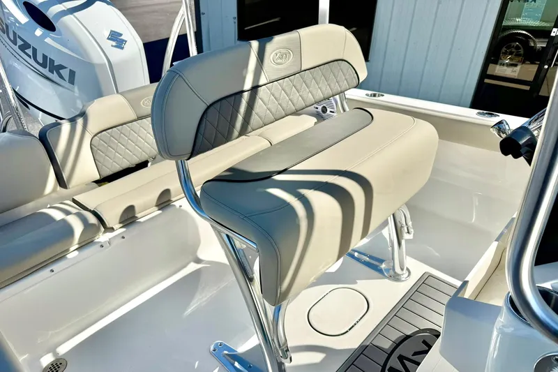 Slide: The Image of 2026 Key West 189 FS boat interior with Suzuki engine, featuring cushioned seating and sleek design. - 18