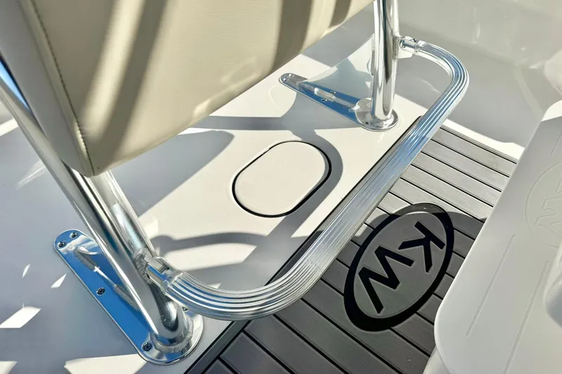 Slide: The Image of 2026 Key West 189 FS boat interior with chrome railing and KW logo on deck. - 19
