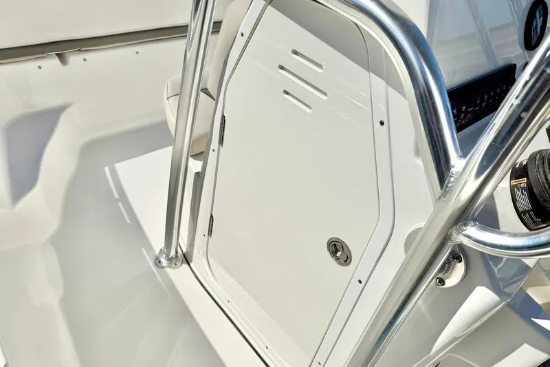 Slide: The Image of 2026 Key West 189 FS boat console with stainless steel railings and storage compartment. - 20