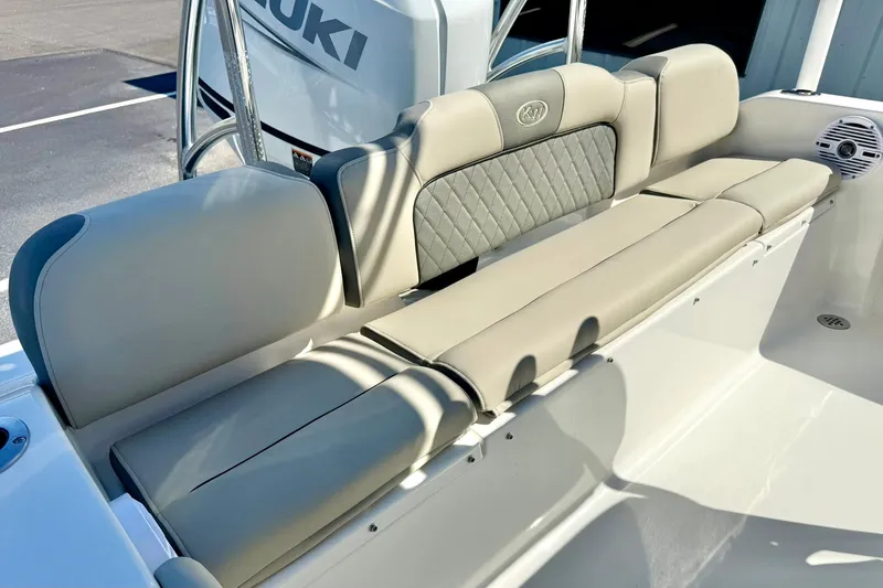 Slide: The Image of 2026 Key West 189 FS boat seating with Suzuki engine, featuring comfortable beige upholstery. - 23