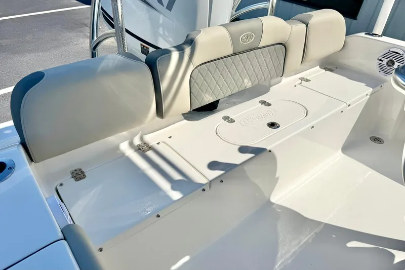 Slide: The Image of 2026 Key West 189 FS boat interior with cushioned seating and storage compartments. - 24
