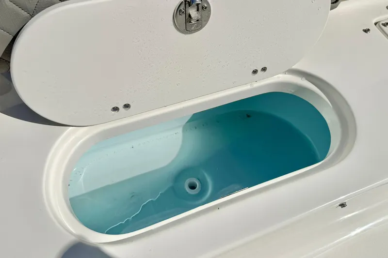 Slide: The Image of Livewell on 2026 Key West 189 FS boat, filled with water. - 26