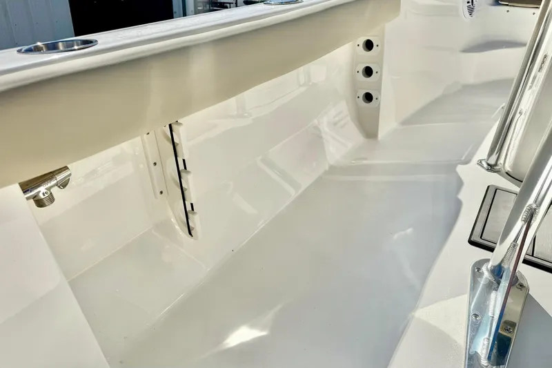 Slide: The Image of 2026 Key West 189 FS boat interior, showcasing sleek white design and stainless steel fittings. - 28
