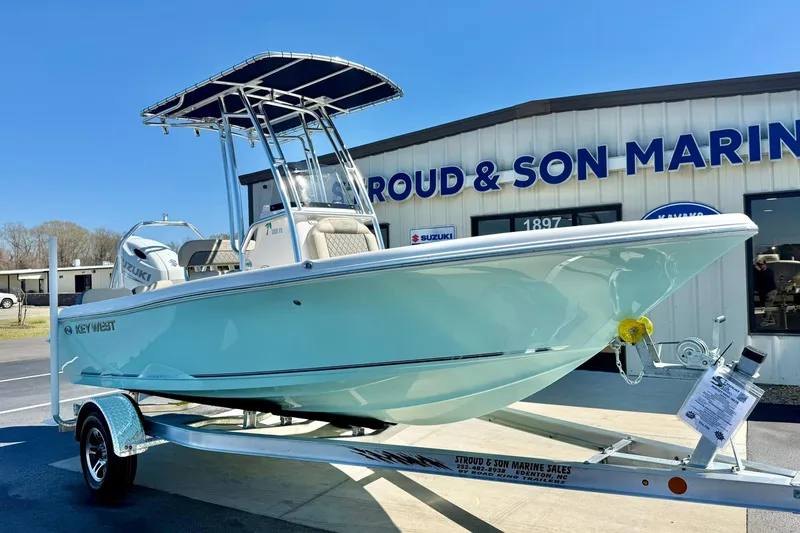 Slide: The Image of 2026 Key West 189 FS boat on trailer at marine dealership. - 4