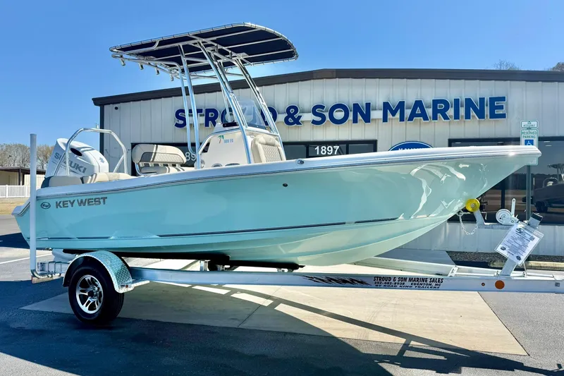 Slide: The Image of 2026 Key West 189 FS boat on trailer at Stroud & Son Marine dealership. - 6