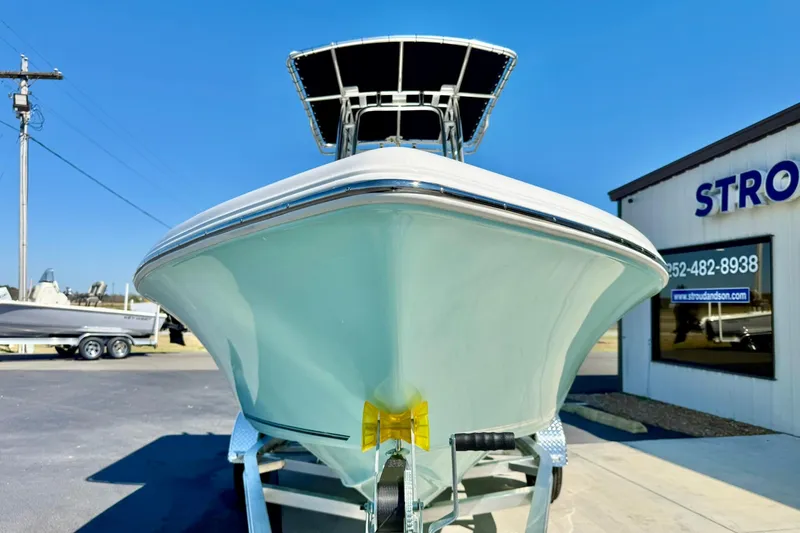 Slide: The Image of 2026 Key West 189 FS boat on trailer, displayed outdoors under clear blue sky. - 8