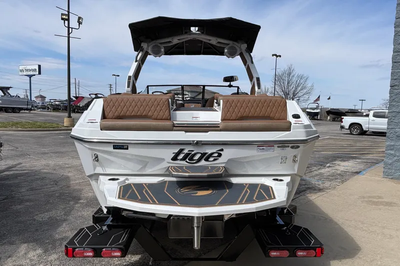 Slide: The Image of 2026 Tigé Z3 boat with brown seating, parked outdoors on a sunny day. - 10