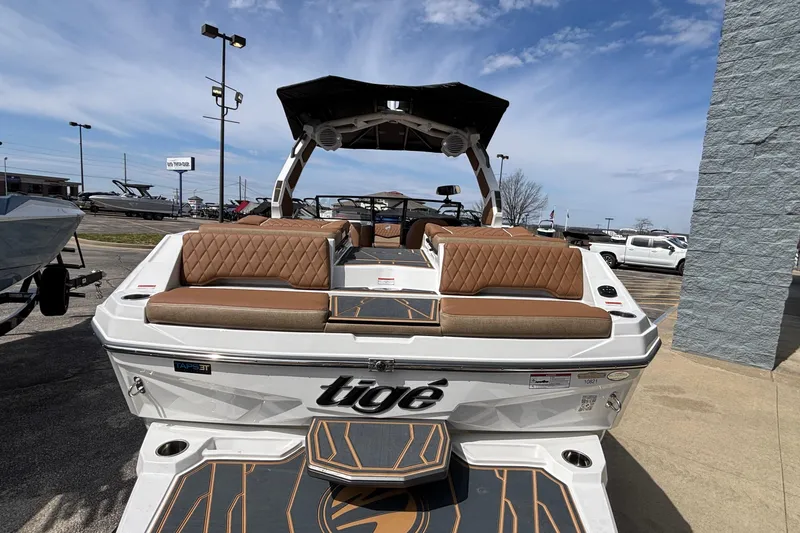 Slide: The Image of 2026 Tigé Z3 boat with luxurious seating and sleek design, displayed outdoors. - 16