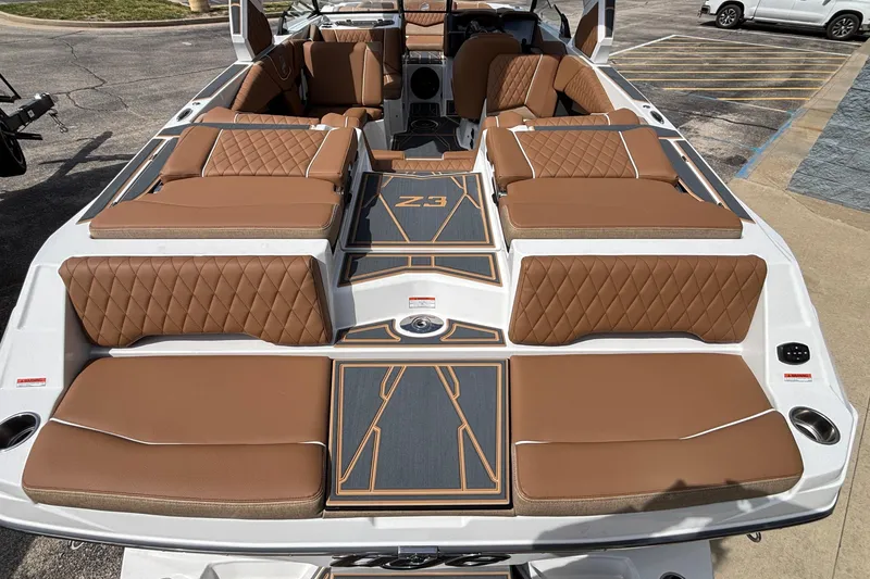 Slide: The Image of Luxurious interior of 2026 Tigé Z3 boat with brown quilted seating and sleek design. - 18