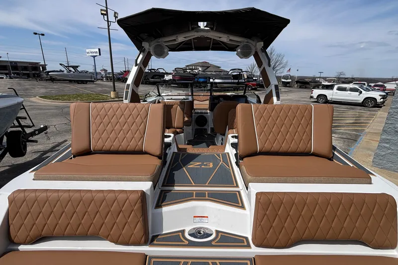 Slide: The Image of 2026 Tigé Z3 boat interior with brown diamond-stitched seating and modern design. - 20