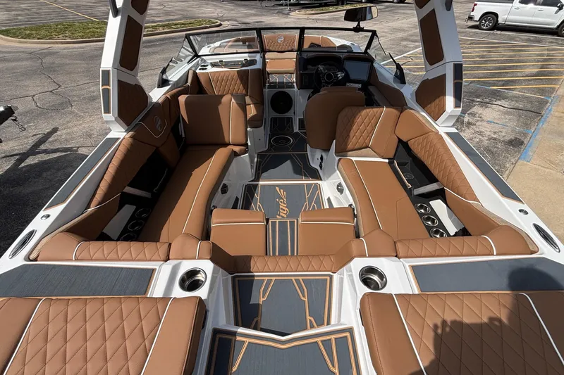 Slide: The Image of Luxurious interior of 2026 Tigé Z3 boat with brown leather seating and modern design. - 21