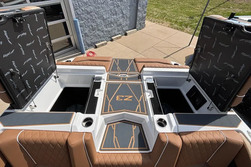 Slide: The Image of 2026 Tigé Z3 boat interior with open storage compartments and luxurious seating. - 24