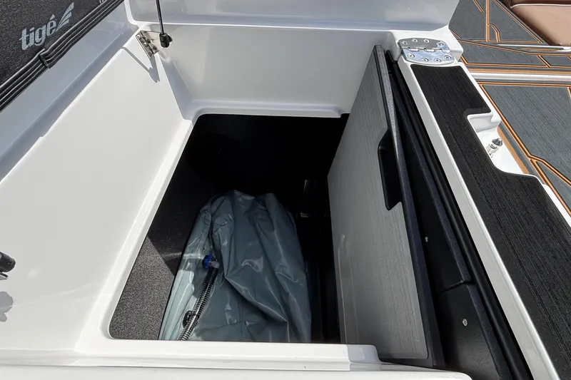 Slide: The Image of Storage compartment of 2026 Tigé Z3 boat with interior view. - 25