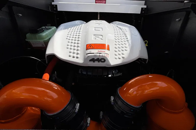 Slide: The Image of Engine compartment of 2026 Tigé Z3 boat with Indmar 440 engine and orange hoses. - 28