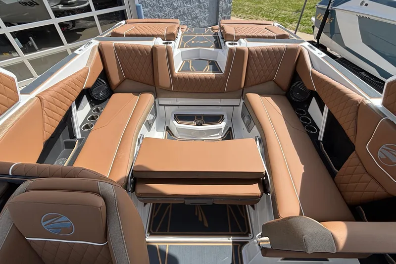 Slide: The Image of Luxurious interior of 2026 Tigé Z3 boat with brown quilted seating and modern design. - 30