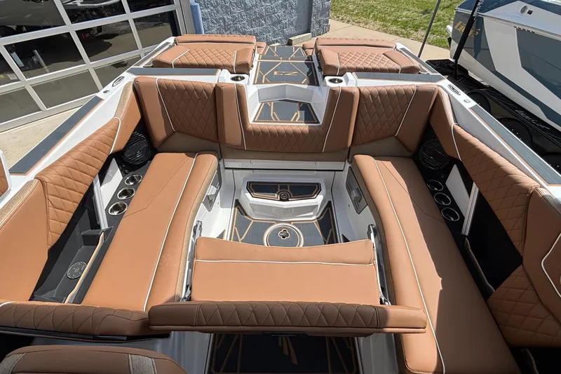 Slide: The Image of Luxurious interior of 2026 Tigé Z3 boat with tan leather seating and cup holders. - 31