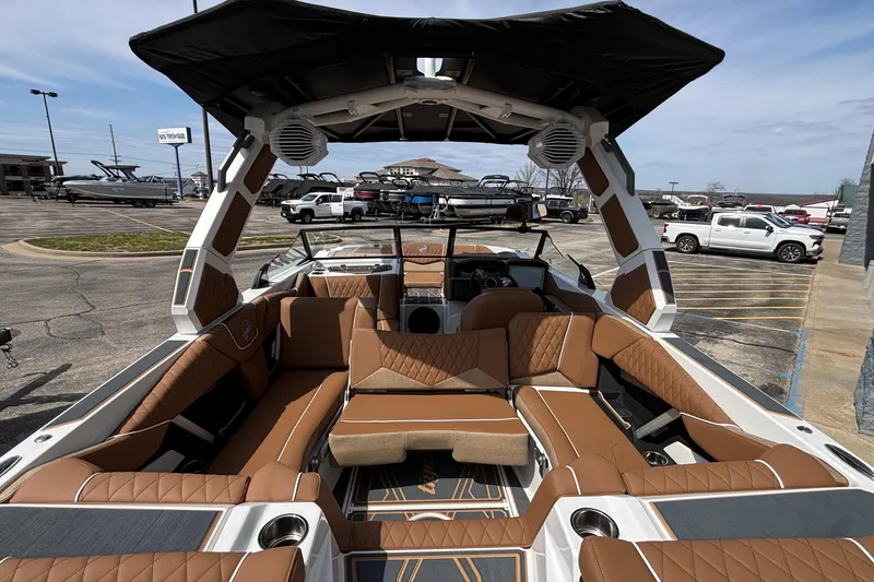 Slide: The Image of 2026 Tigé Z3 boat interior with luxurious brown seating and modern design features. - 32