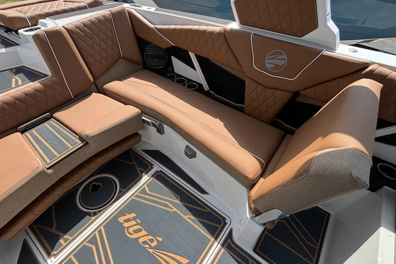 Slide: The Image of Luxurious interior of 2026 Tigé Z3 boat with brown quilted seating and stylish flooring. - 37