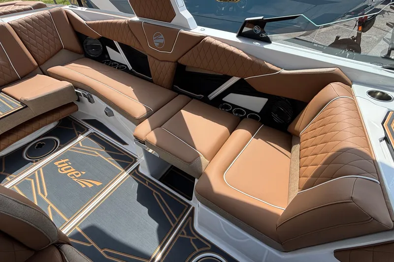 Slide: The Image of Luxurious interior of 2026 Tigé Z3 boat with brown leather seating and stylish flooring. - 38