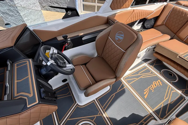 Slide: The Image of 2026 Tigé Z3 boat interior with luxurious brown leather seating and modern dashboard design. - 39