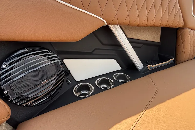 Slide: The Image of 2026 Tigé Z3 interior detail with speaker, cup holders, and quilted leather upholstery. - 41