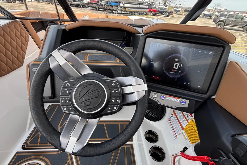 Slide: The Image of 2026 Tigé Z3 boat dashboard with steering wheel and touchscreen display. - 46