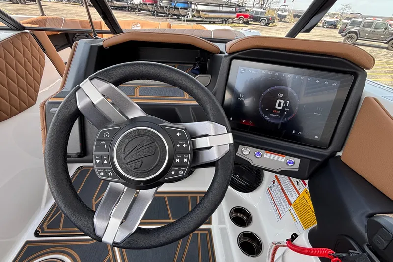 Slide: The Image of Steering wheel and dashboard of 2026 Tigé Z3 boat with touchscreen display. - 47