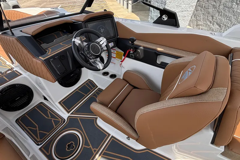 Slide: The Image of 2026 Tigé Z3 boat interior with luxurious brown seating and modern dashboard design. - 52
