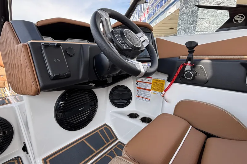 Slide: The Image of 2026 Tigé Z3 boat interior with modern steering wheel and audio system. - 53