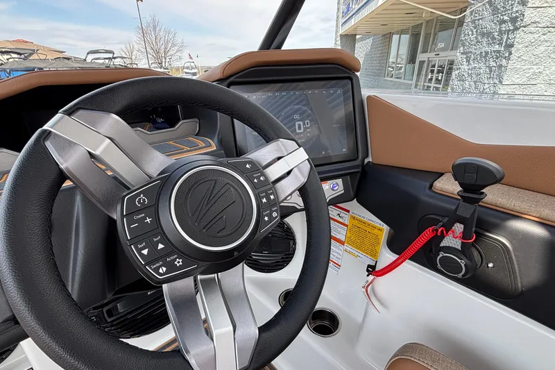 Slide: The Image of 2026 Tigé Z3 boat dashboard with steering wheel and digital display. - 54