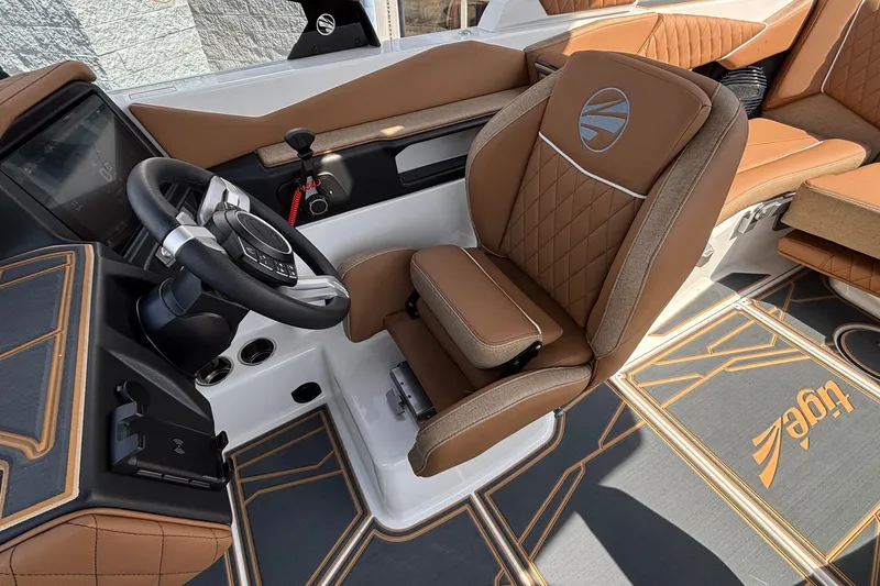 Slide: The Image of Luxurious interior of 2026 Tigé Z3 boat with brown leather seating and modern dashboard. - 55