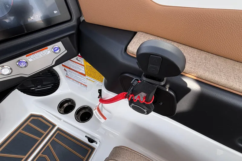 Slide: The Image of Interior of 2026 Tigé Z3 boat with control panel and safety features. - 56