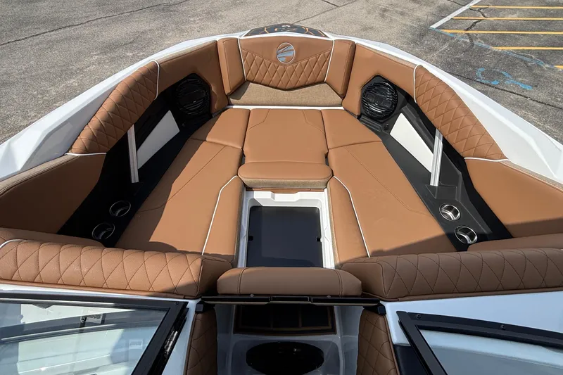 Slide: The Image of 2026 Tigé Z3 boat interior with luxurious brown seating and cup holders. - 60