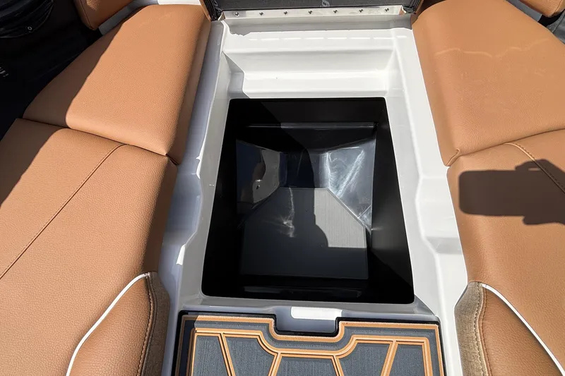 Slide: The Image of 2026 Tigé Z3 boat interior storage compartment with tan seating and sleek design. - 64
