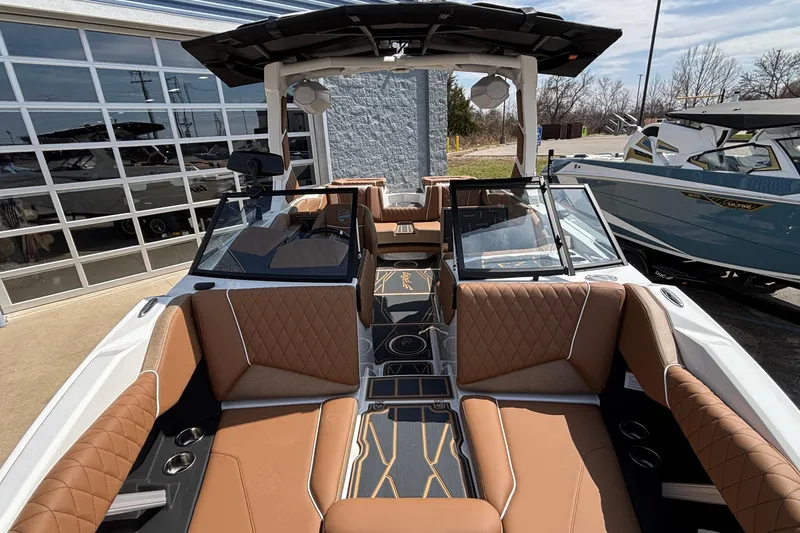 Slide: The Image of 2026 Tigé Z3 boat interior with luxurious brown seating and modern design. - 66