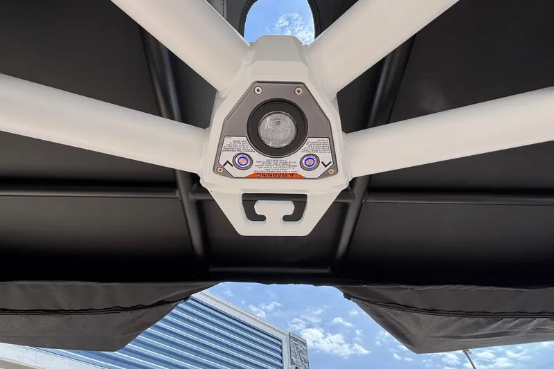 Slide: The Image of 2026 Tigé Z3 boat tower with integrated speaker and warning labels under a clear sky. - 68