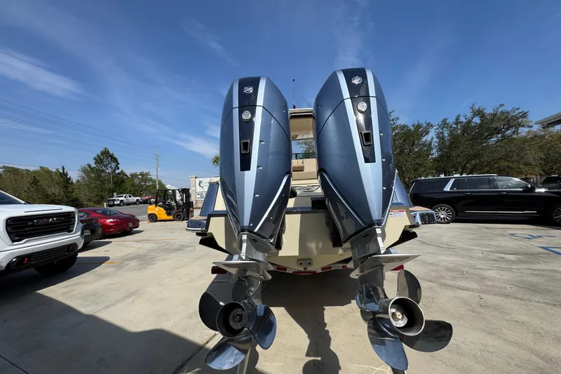 Slide: The Image of 2026 Chris-Craft Launch 35 GT with dual outboard motors in a parking lot. - 14