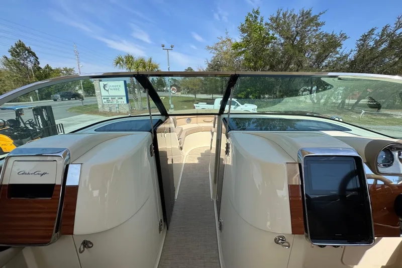 Slide: The Image of 2026 Chris-Craft Launch 35 GT boat interior with dual consoles and glass windshield. - 24
