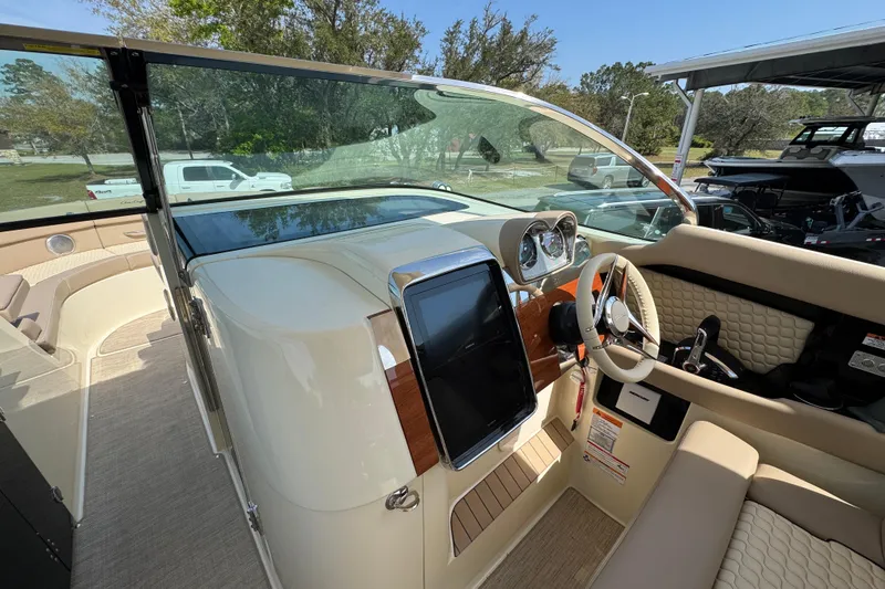 Slide: The Image of 2026 Chris-Craft Launch 35 GT boat interior with modern dashboard and steering wheel. - 25