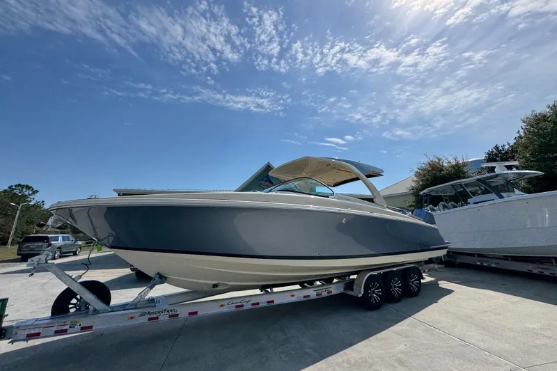 Slide: The Image of 2026 Chris-Craft Launch 35 GT boat on trailer under clear blue sky. - 3