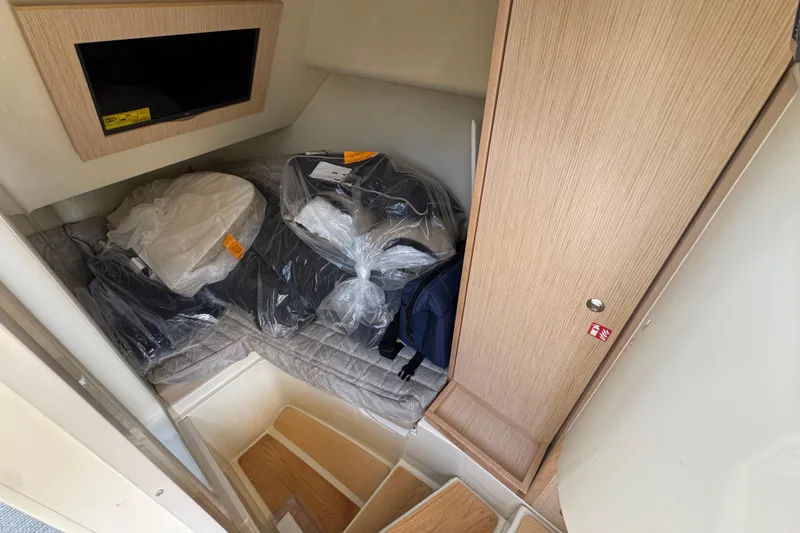 Slide: The Image of Interior cabin of 2026 Chris-Craft Launch 35 GT with storage and wooden finishes. - 34