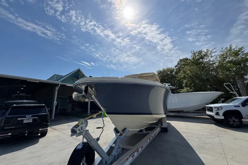 Slide: The Image of 2026 Chris-Craft Launch 35 GT boat on trailer under sunny sky. - 5