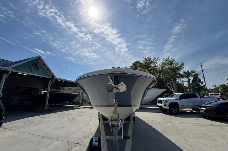 Slide: The Image of 2026 Chris-Craft Launch 35 GT boat on trailer under sunny sky. - 6