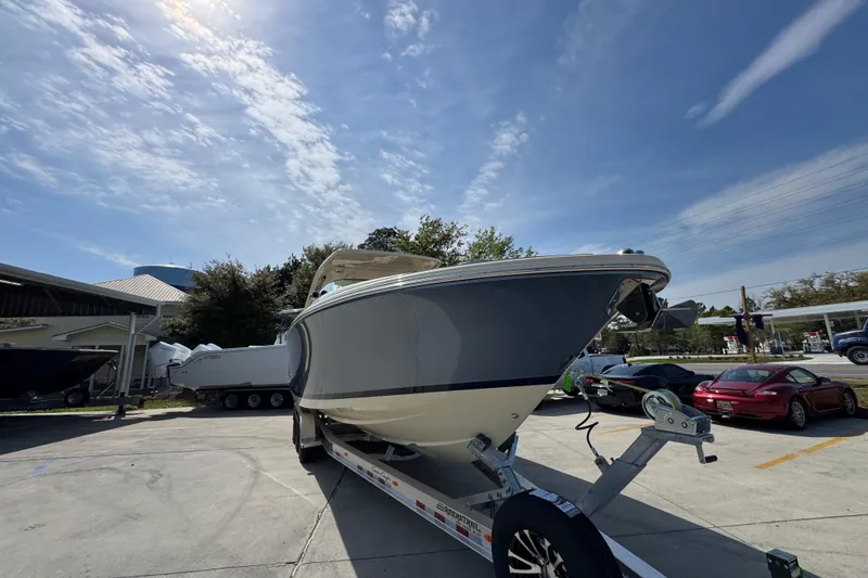 Slide: The Image of 2026 Chris-Craft Launch 35 GT boat on trailer under a sunny sky. - 7