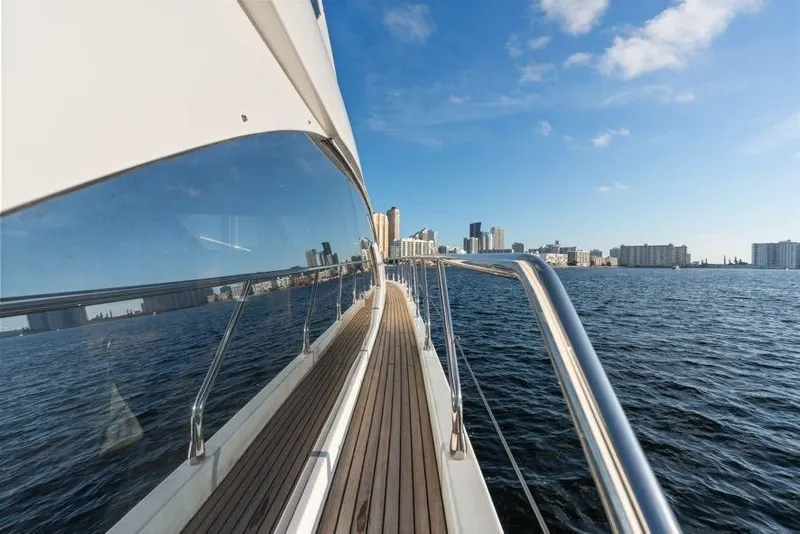 Slide: The Image of 2017 Azimut 66 yacht deck with city skyline and ocean view. - 12