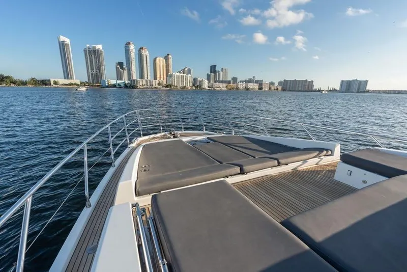 Slide: The Image of Azimut 66 yacht deck with city skyline view, 2017 model, cruising on calm waters. - 13